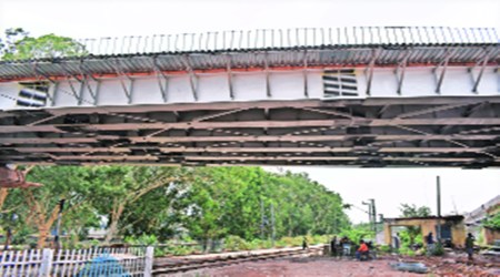 Girders being laid at the railway over-bridge. Express