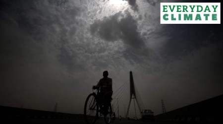 A cyclist in New Delhi on Monday, when some parts of the city recorded temperatures as high as 49.2 degrees Celsius. (Express Photo: Praveen Khanna)