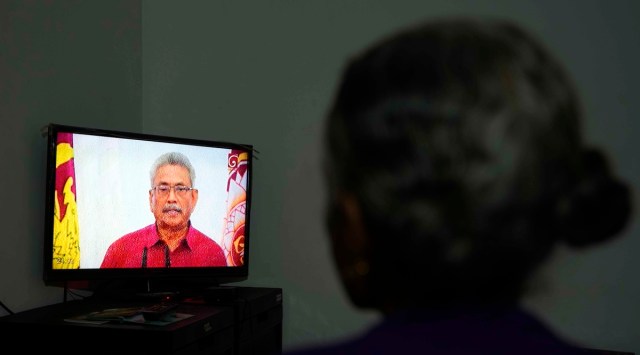 A Sri Lankan woman watches a telecast speech of President Gotabaya Rajapaksa at her house in Colombo, Sri Lanka,May 11, 2022. (AP/PTI)