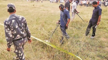 Telangana policemen at the site of the encounter on the outskirts of Hyderabad, Friday. (Express Photo: Arun Janardhanan)
