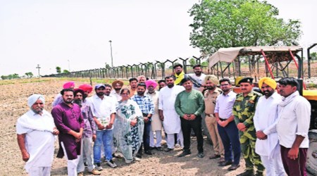 While launching direct sowing of rice on land across the fence close to Indo-Pak border in village Parbhat Singh Wala of Fazilka, Monday. Express