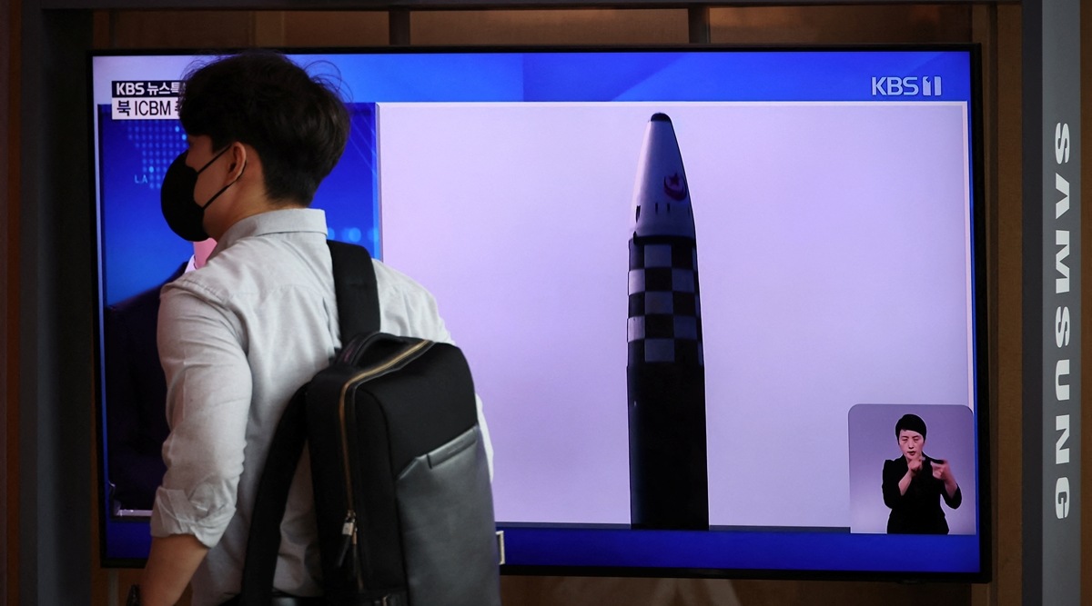 A man walks past a TV broadcasting a news report on North Korea's launch of three missiles what appeared to have involved an intercontinental ballistic missile (ICBM), in Seoul, South Korea, May 25, 2022.     REUTERS/Kim Hong-Ji