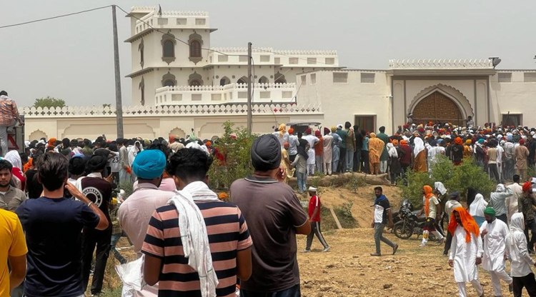 A crowd gathered outside Sidhu Moosewala's residence to pay their respects. (Express Photo)