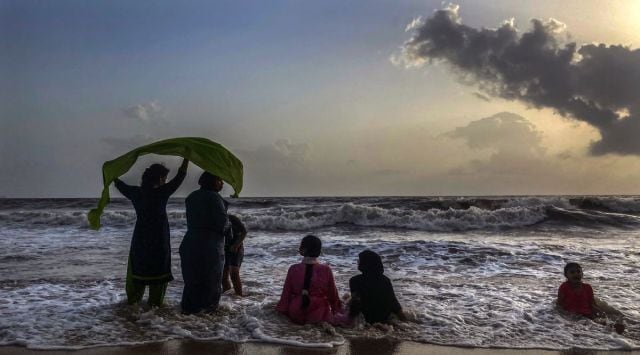 People enjoy an evening at Juhu beach, Monday , May 23, 2022. (AP Photo/Rafiq Maqbool)