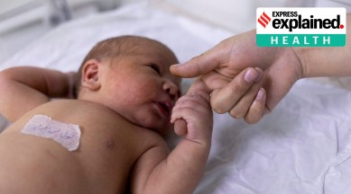 A newborn baby holds on a nurse's finger at the maternity ward of the children hospital in Kabul, Afghanistan. (Reuters Photo/File)