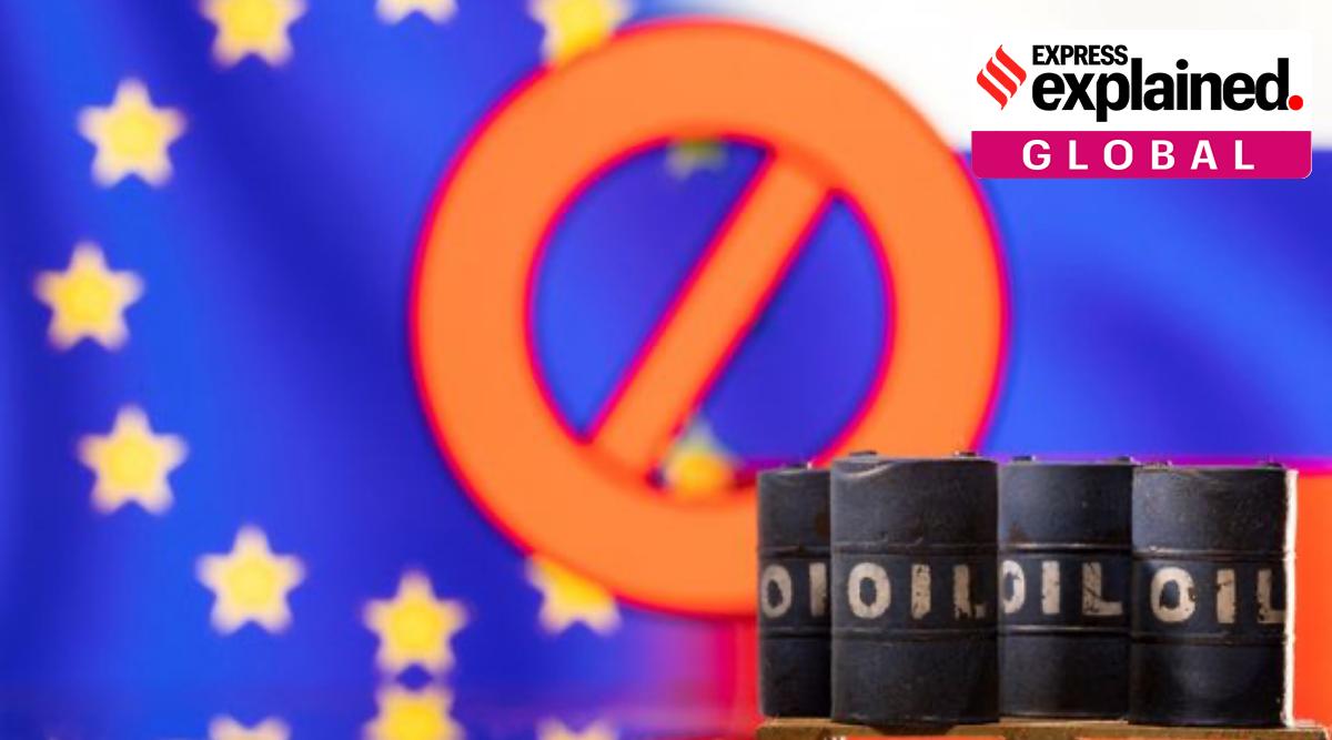 Models of oil barrels are seen in front of the displayed sign "stop", EU and Russia flag colours in this illustration taken March 8, 2022. (Reuters)