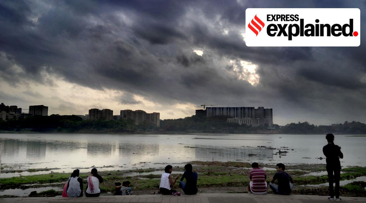 Dark clouds gather over Powai Lake in Mumbai. (Express Photo/File)