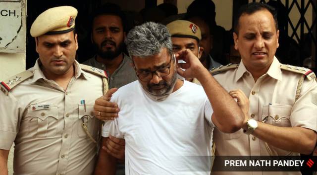 DU professor Ratan Lal after being produced in a Delhi court on Saturday.