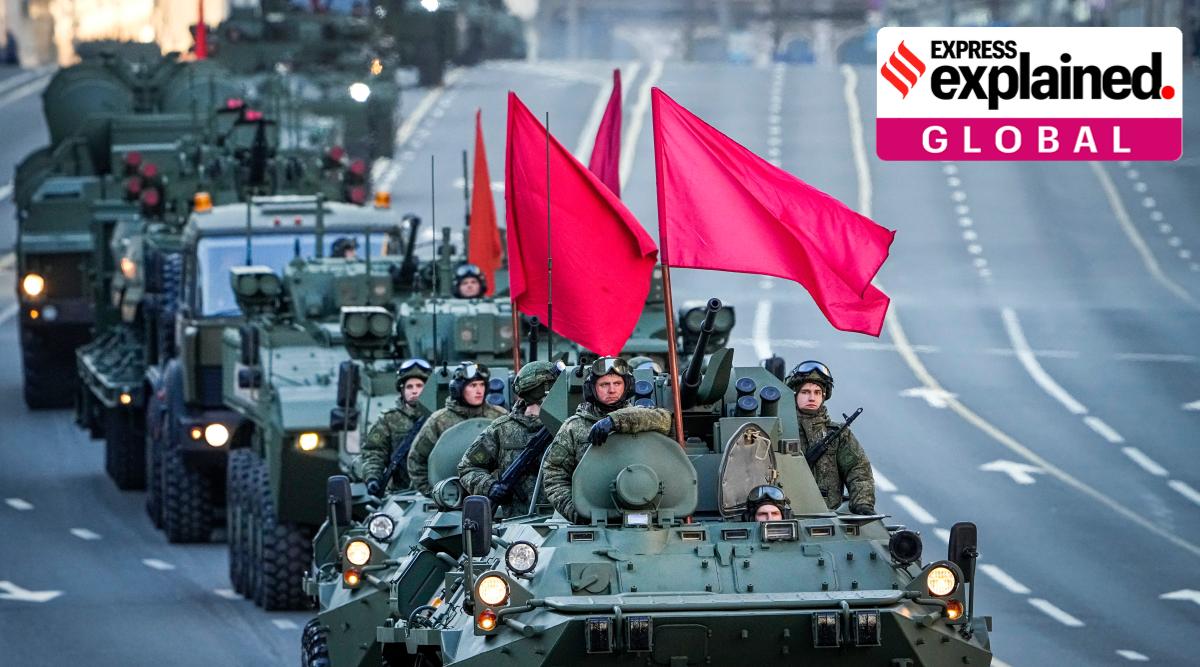 Russian armored vehicles decorated with red flags roll along Tverskaya street toward Red Square to attend a rehearsal for the Victory Day military parade in Moscow, Russia, Wednesday, May 4, 2022. (AP Photo/Alexander Zemlianichenko)