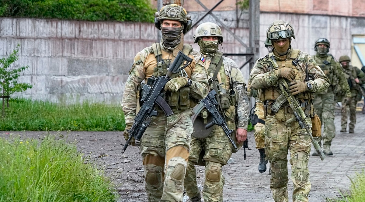 File image: Russian troops walk at a destroyed part of the Illich Iron & Steel Works Metallurgical Plant in Mariupol, Ukraine. (May 18, 2022/ AP)