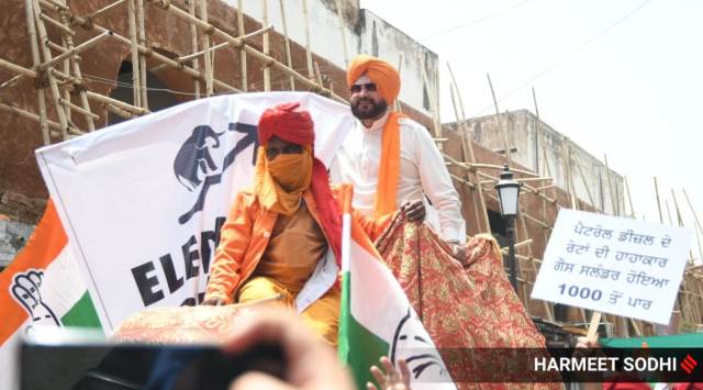 Ex-Punjab Pradesh Congress Committee President Navjot Singh Sidhu along with his supporters take part in a mega rally against the rapid inflation of petrol, diesel and gas prices in Patiala on Thursday.
