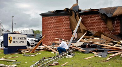Surrounded by tornado damage Paul Campbell, Founder of the academy of Seminole sits outside of the school in Seminole, Oklahoma on May, 5, 2022. (AP)