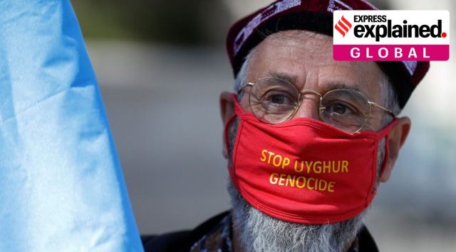 A demonstrator wears a face mask as he attends a protest against Uyghur genocide, in London, Britain April 22, 2021. REUTERS/Peter Nicholls
