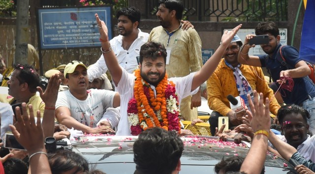 AAP candidate Durgesh Pathak celebrates with supporters after winning Rajinder Nagar by-elections, in New Delhi, Sunday, June 26, 2022. (PTI Photo/Shahbaz Khan)