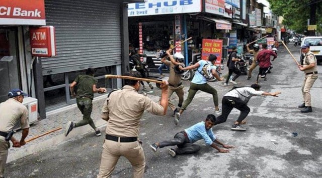 Police lathi-charge people protesting against Centre's 'Agnipath' scheme, in Haldwani, Friday, June 17, 2022. (PTI)