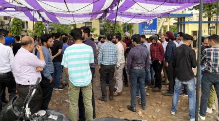 Bank employees protest the manager’s firing. (Express Photo)