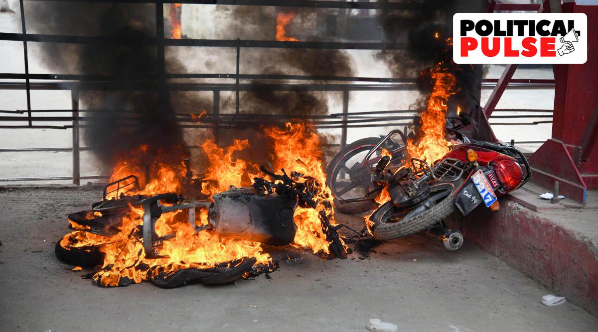 Protester set ablaze vehicles in protest against the 'Agnipath' scheme outside Danapur Railway Station, near Patna, Friday, June 17, 2022. (PTI Photo)