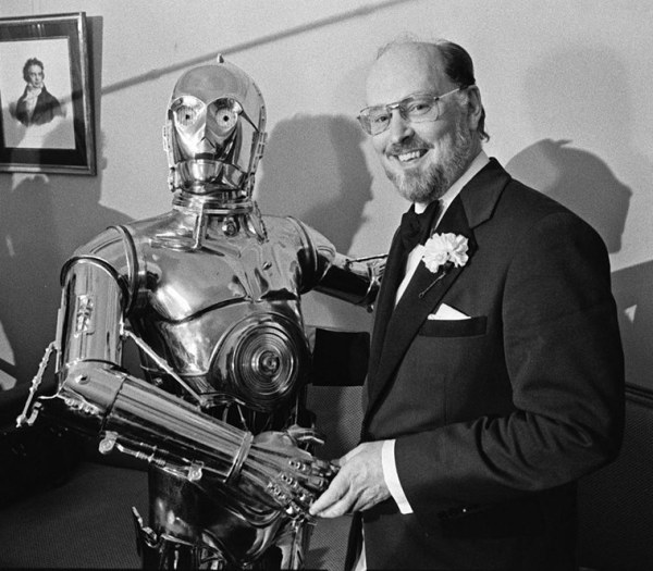 Boston Pops conductor John Williams, right, shakes hands with Star Wars character C-3PO at a news conference in Boston on April 30, 1980. (Photo: AP)