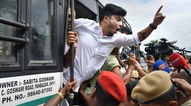 Police personnel detain NSUI activists as they protest against rebel Maharashtra MLAs led by Shiv Sena leader Eknath Shinde, in Guwahati, Thursday, June 23, 2022. (PTI Photo)