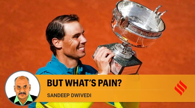 Spain's Rafael Nadal holds the trophy after winning the final match against Norway's Casper Ruud in three sets, 6-3, 6-3, 6-0, at the French Open tennis tournament in Roland Garros stadium in Paris, France. (AP)