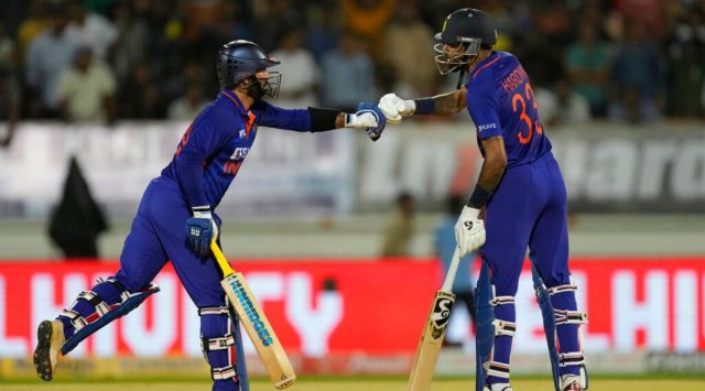 India's Hardik Pandya, right, and India's Dinesh Karthik encourage each other during the fourth Twenty20 cricket match between India and South Africa in Rajkot, India, Friday, June 17, 2022. (AP Photo/Ajit Solanki)