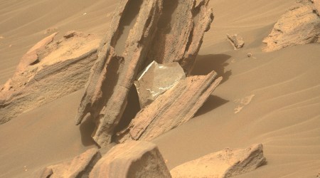 image from perseverance rover showing a piece of foil stuck on a rock