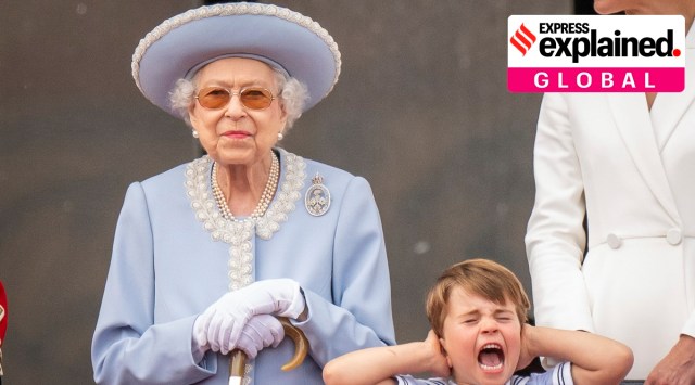 Queen Elizabeth II stands as Prince Louis covers his ears on the balcony of Buckingham Palace after the Trooping the Colour ceremony at Horse Guards Parade, central London on Thursday. (Photo: AP)