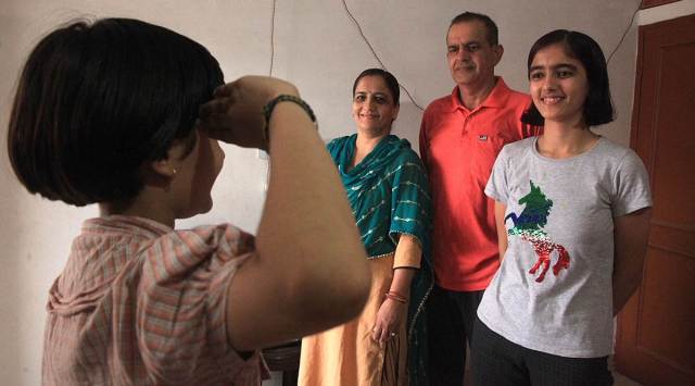 Shanan Dhaka (right) with her family at their residence in Zirakpur on Tuesday. (Express photo by Jaipal Singh)