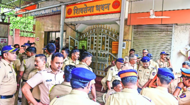 Police personnel outside the Shiv Sena Bhavan at Dadar in Mumbai, on Friday. (PTI)
