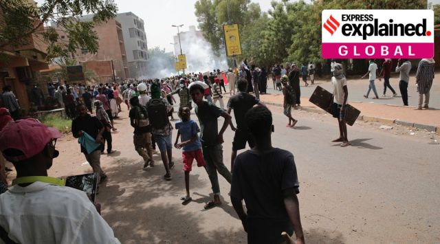 Protesters clash with security forces as they fire teargas to prevent them from marching towards the presidential palace during demonstrations in Khartoum, Sudan, May 19, 2022. (AP Photo/Marwan Ali, File)