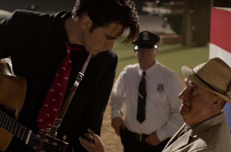 Tom Hanks, as Col. Tom Parker, with Austin Butler as the title character in “Elvis.” Warner Bros. Pictures
