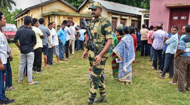 People wait in a queue at a polling station in Agartala. (Photo: PTI)
