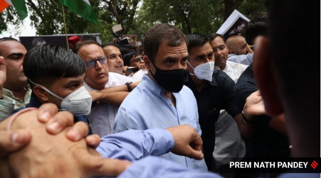 Rahul Gandhi with party workers at march to ED office in Delhi on Monday. (Express Photo by Prem Nath Pandey)