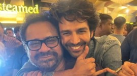 Anees Bazmee poses with Bhool Bhulaiyaa 2 star Kartik Aaryan.