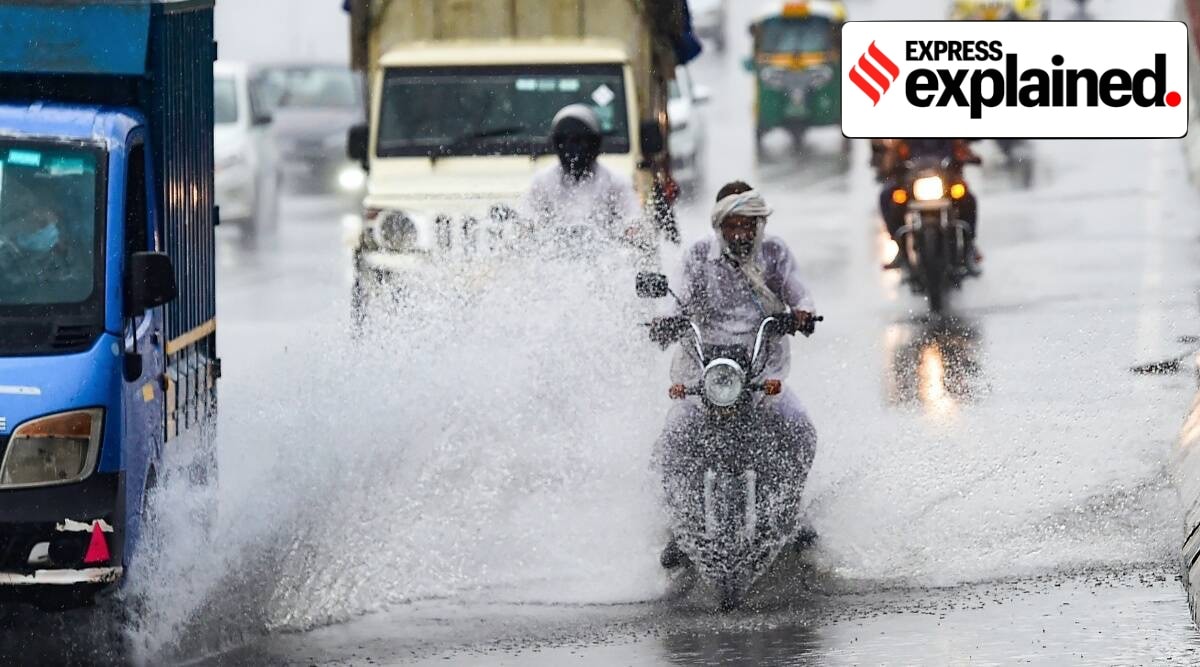 Vehicles ply on a waterlogged road after heavy rains in New Delhi. (PTI)