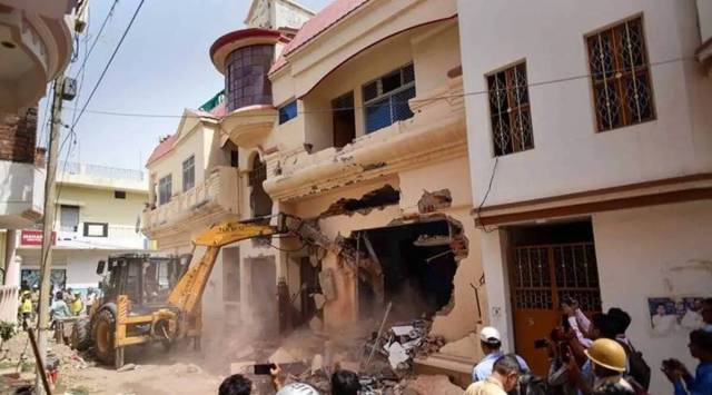 A bulldozer being used to demolish the residence of Javed Ahmed, in Prayagraj. (PTI/File)
