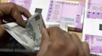 Rupee hits record low on capital outflows