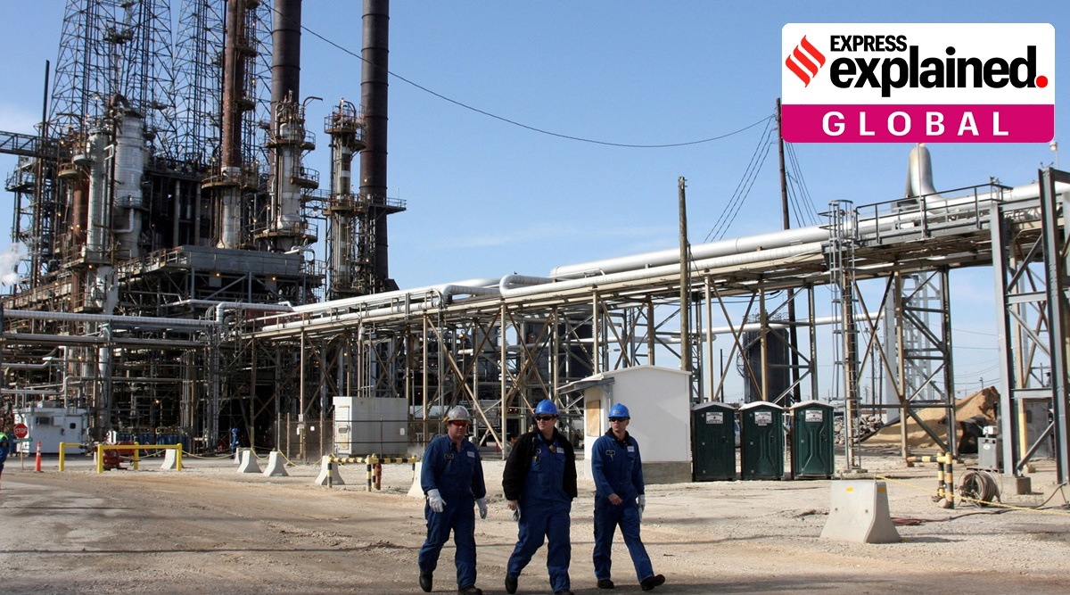Refinery workers walk inside the LyondellBasell oil refinery in Houston, Texas(Reuters)