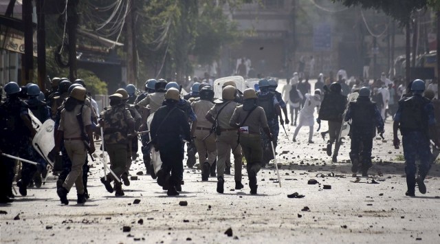 Brick-bats lie on the road as police personnel attempt to disperse agitators during a protest over the controversial remarks by two now-suspended BJP leaders against Prophet Mohammad, after the Friday prayers, in Prayagraj. (PTI)