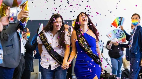 pride month, pride month same sex couple proposal, in flight proposal, flight proposal, flight attendant pilot proposal, indian express