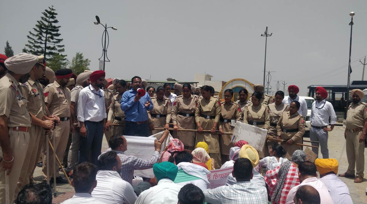 A protest by 'Overage Berozgar Union' outside Dreamland colony in Sangrur on Saturday. (Express Photo: Raakhi Jagga)
