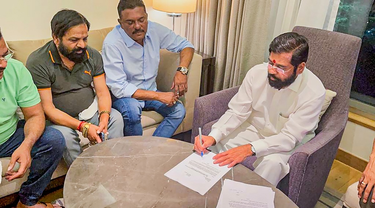 Rebel Shiv Sena leader Eknath Shinde with other MLAs during a meeting, in Guwahati, Wednesday, June 22, 2022. (PTI)