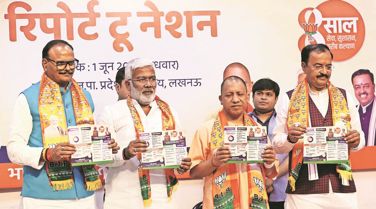 CM Yogi Adityanath, deputy CMs Kehsav Prasad Maurya and Brajesh Pathak, and minister Swatantra Dev Singh release a ‘report card’, in Lucknow on Wednesday. (Express photo by Vishal Srivastav)