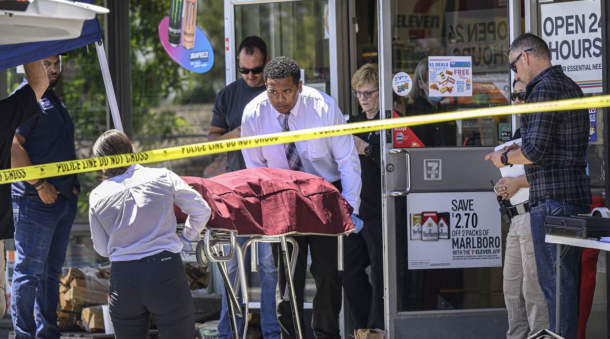 Authorities remove a body from a 7-Eleven after a clerk was fatally shot on Monday, July 11, 2022, during a robbery in Brea, Calif. (AP)