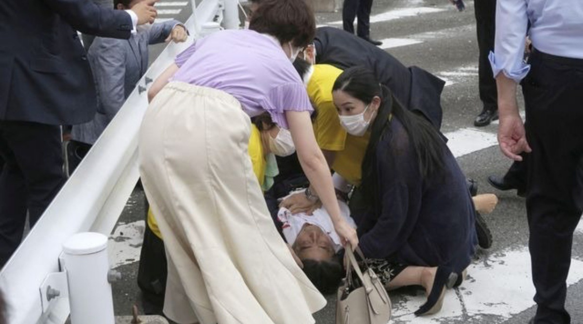 Former Japanese prime minister Shinzo Abe lies on the ground after the shooting during an election campaign, in Nara, July 8, 2022. (Reuters File Photo/ Representative)