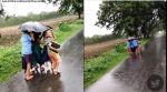 Kids under single umbrella, kids in rain, rain, monsoon, children, viral video, indian express