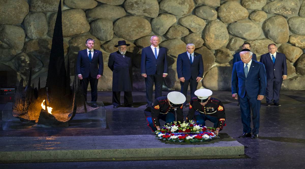 President Joe Biden standing at right,  in a wreath-laying ceremony at Yad Veshem, Israel’s official Holocaust memorial in Jerusalem. (Doug Mills/The New York Times) 