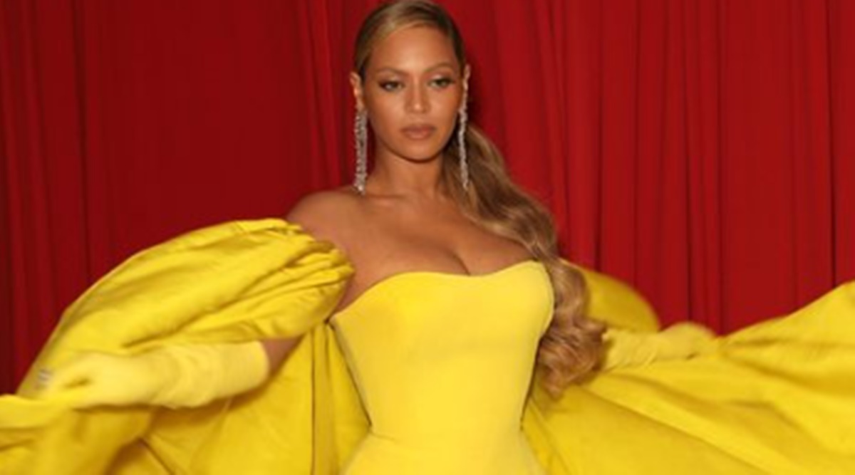 Beyoncé celebrates album release in a silver gown with a thigh-high ...