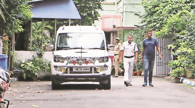 The minister’s official car outside his Kolkata residence on Tuesday morning, before it was moved to the Assembly. (Express Photo by Partha Paul)