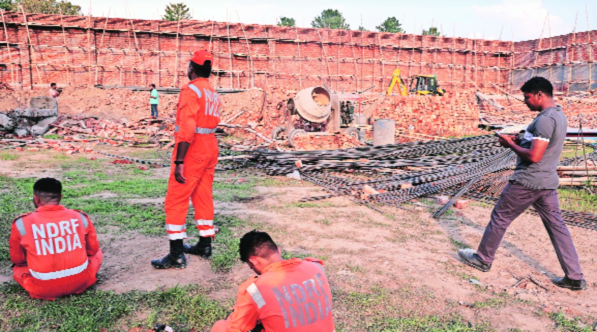 Eight people were injured after the wall at the under-construction godown collapsed in Alipur, Friday. (Express photo by Amit Mehra)